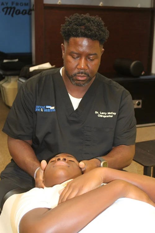 Chiropractor Nashville TN Larry McCoy Adjusting Patient Chiropractor Nashville TN Larry McCoy Adjusting Patient